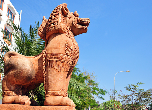 Vientiane, Laos: guardian lion (lion dogs or foo dog) on Lane Xang Avenue, common in Laotian iconography and architecture, known localy as 'Chinthe', they are used in a similar way to Chinese imperial guardian lions, but with a traditional Laotian style design.