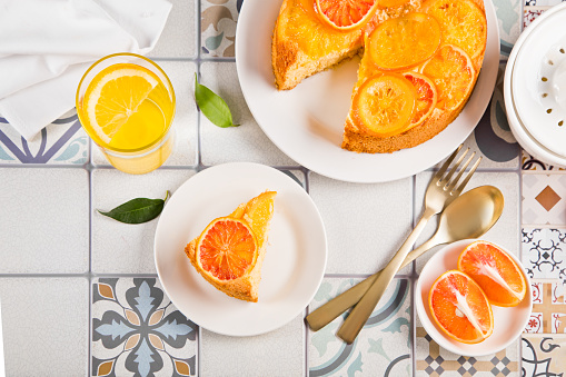 Orange cake with fruit citrus slices. Top view
