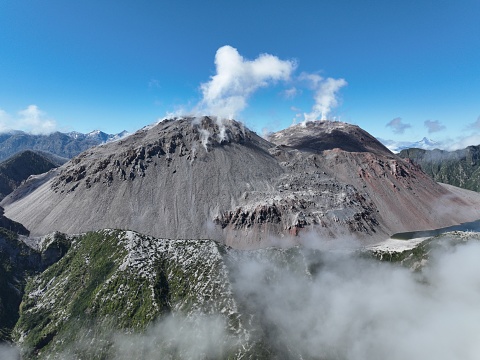 Aerial view of Chaiten volcano emitting gases from the sides of its cone