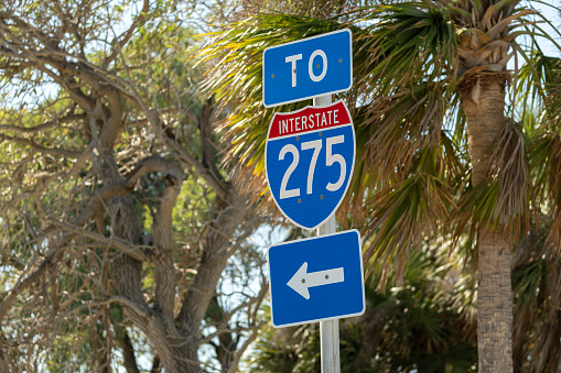 Blue direstional road sign indicating direction to I-275 freeway interstate highway serving the Tampa Bay area in Florida.