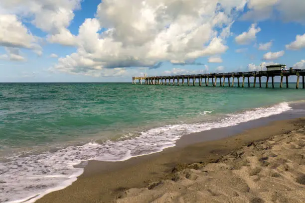 Photo of Bright ocean landscape at Venice fishing pier in Florida, USA. Popular vacation place in south