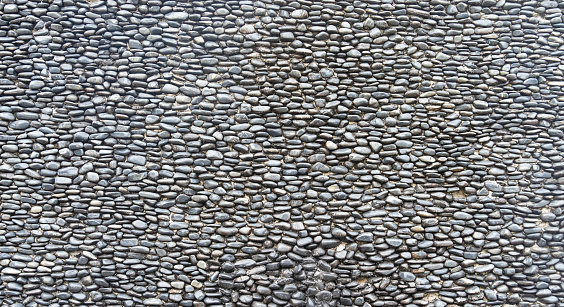 background made of a closeup of a wall with pebbles