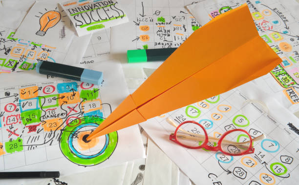 istock Calendars with business appointments and a paper rocket hitting a target.Business concept beat the clock, reaching a goal and business planning 2045730152