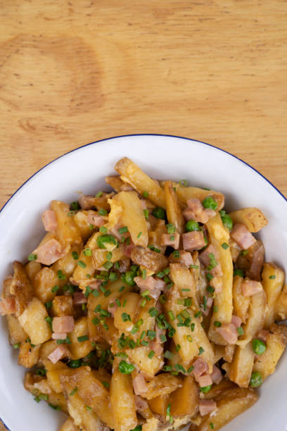 istock Gourmet fried potatoes with a wooden background 2045732278