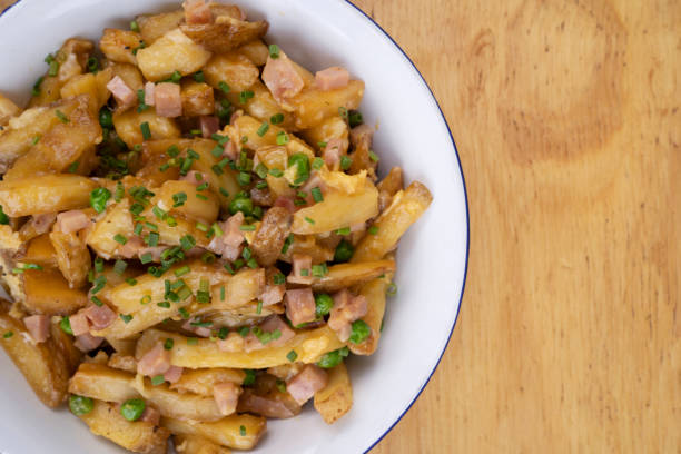 istock Gourmet fried potatoes with a wooden background 2045744207