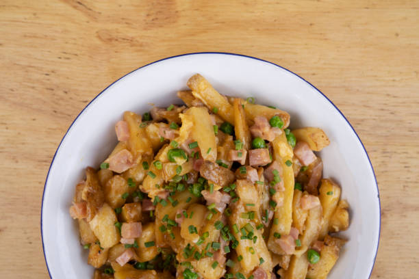 istock Gourmet fried potatoes with a wooden background 2045744209