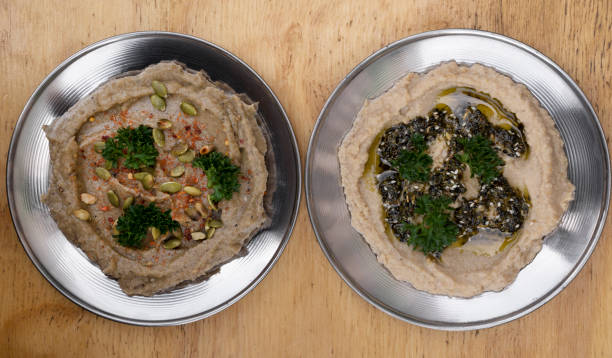 top view of hummus and baba ganoush dishes - eggplant dip baba ghanoush middle eastern cuisine imagens e fotografias de stock