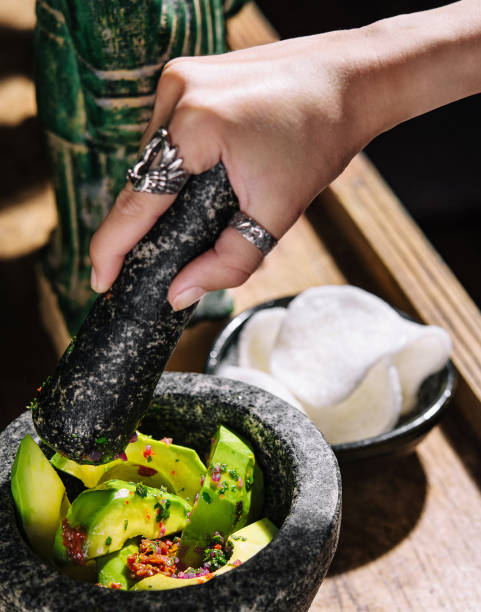 istock Guacamole in a mortar with rice chips 2045754386