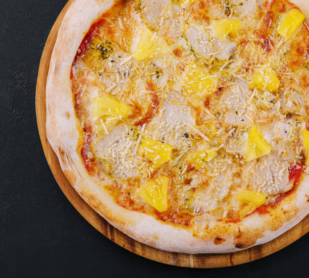 istock Tasty hawaiian pizza with chicken and pineapple 2045754393
