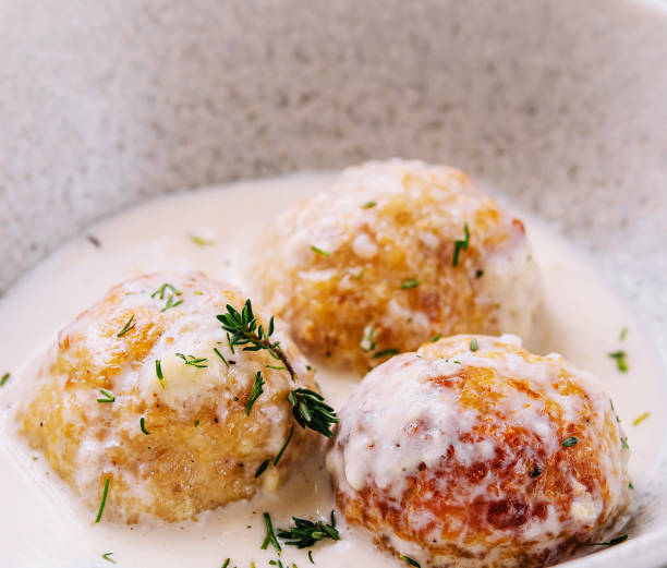 istock Creamy sauce fried meatballs on plate 2045754983