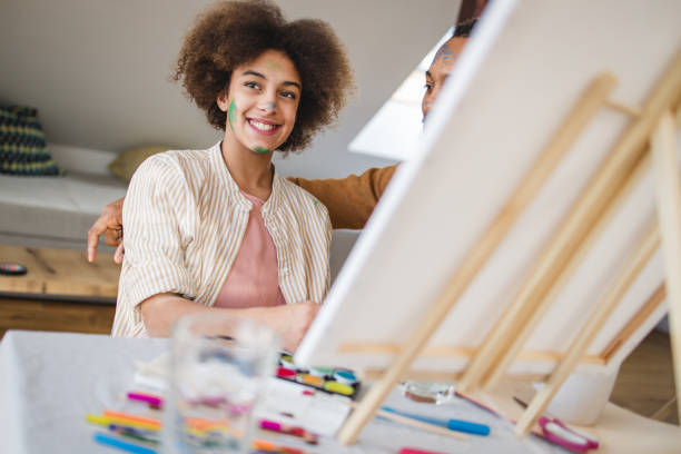 istock Father and daughter painting together 2045767871