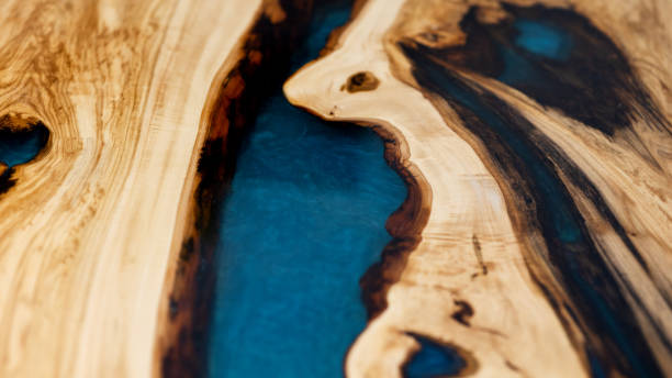 istock texture of a rough pine board with brown bark and epoxy resin on a blue background 2045786459