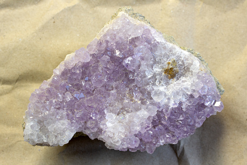 specimen of natural rough quartz crystal cutout on white background