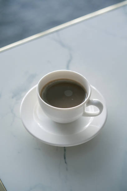 Simple porcelain cup stands on the table