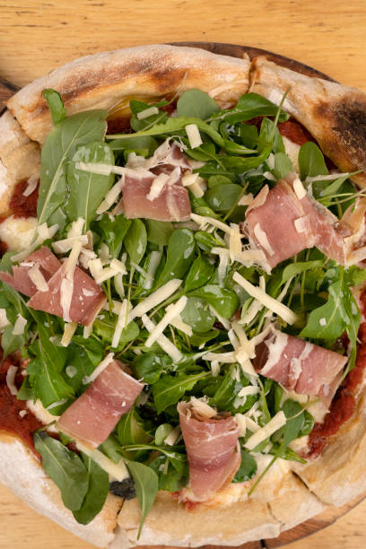 istock Gourmet pizza with arugula and prosciutto 2045815081