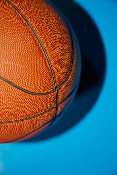 istock Basketball ball on a blue background, close-up 2045816653