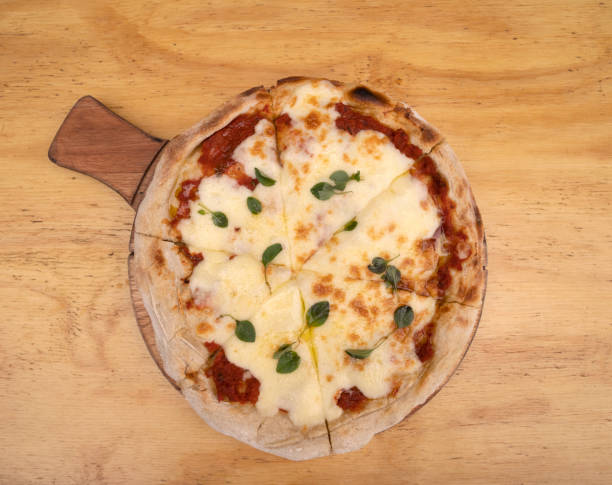 istock A traditional mozzarella cheese pizza with a wooden background 2045818763