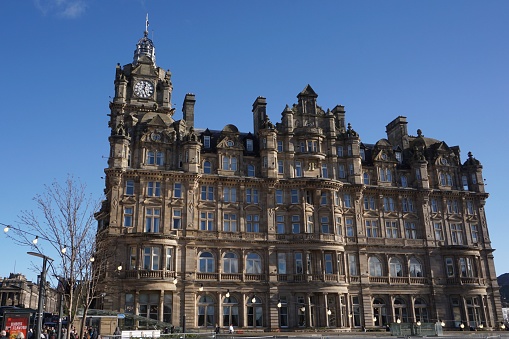 Edinburgh, Scotland - 26 February 2024: The Balmoral Hotel at the East end of Princes street in the early afternoon spring sunshine.