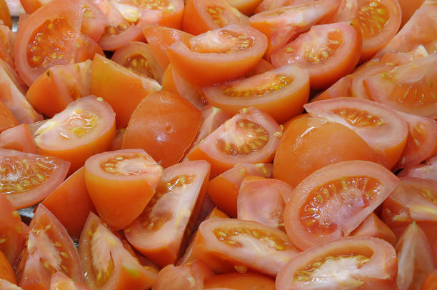 Pieces of cut tomatoes on a tray