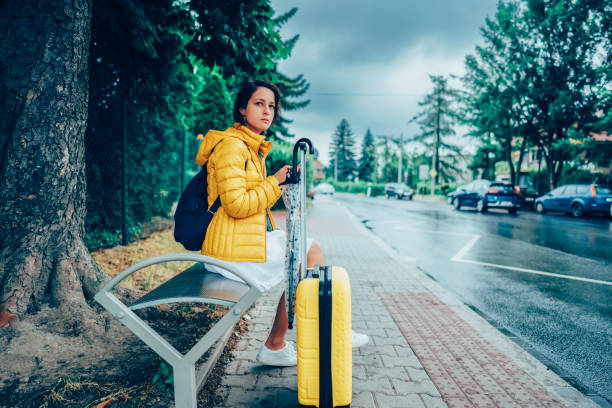 istock Tourist waiting at the bus stop 2045842844