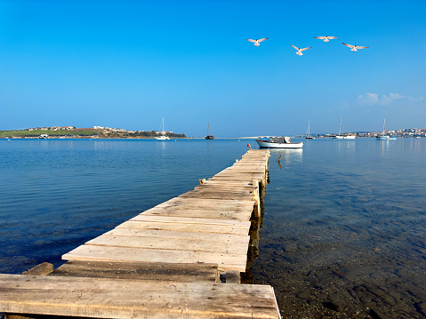 Wooden boat deck at small seaside town Ayvalık, Cunda, Aegean Turkey