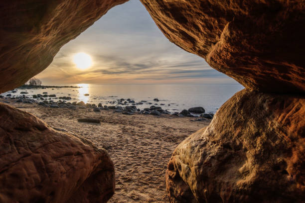 istock Cave's Embrace: Sunset Glow in Veczemju Klintis 2045875452