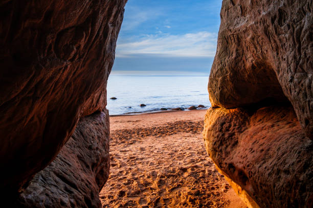 istock Dusk's Serenade: Sunset Spectacle from Veczemju Klintis Cave 2045875973