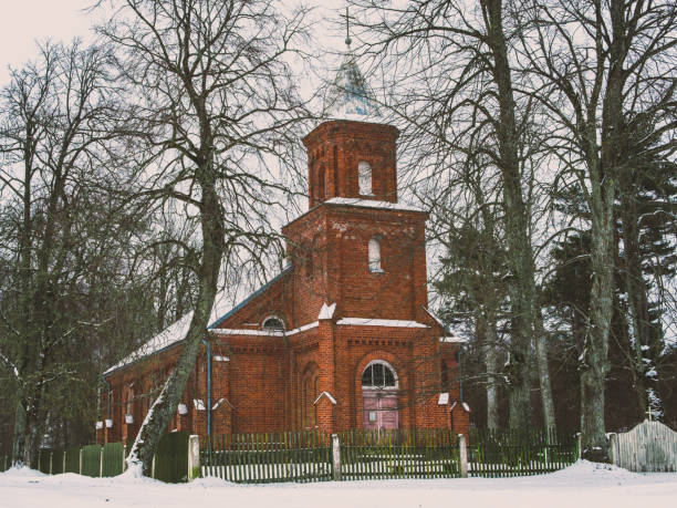 Enveloped in a blanket of snow, Mikeltornis Church stands serenely against the chill, offering solace and warmth amidst the tranquil beauty of the winter season.