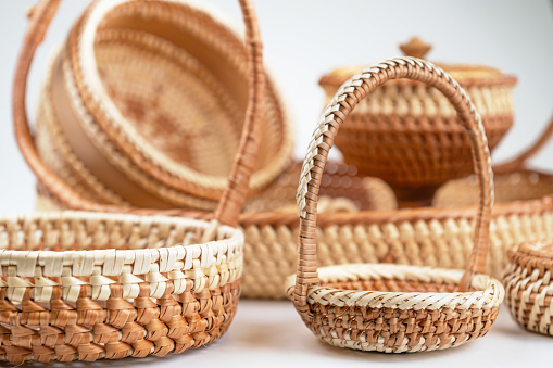 Wicker baskets isolated on white background. Basket made of natural materials, close-up
