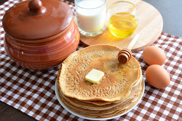 Pancakes with Butter, Pecans and Maple Syrup