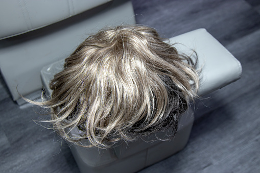 fake wig on store counter