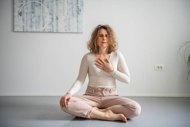 istock Woman doing yoga at home 2045948574