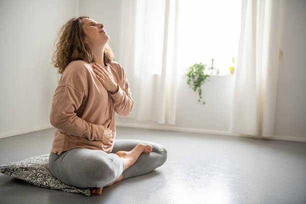 istock Woman doing yoga at home 2045953772