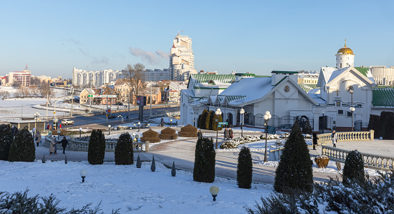 Minsk, Belarus - January 7, 2024: Cityscape with Minsk Theological Academy, Trinity Suburb and modern residential houses on the background
