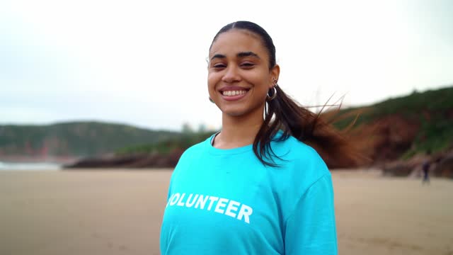 A female volunteer looks at the camera
