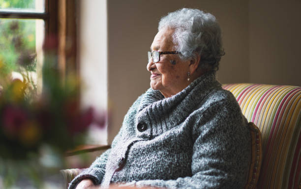istock Window, thinking and elderly woman in nursing home, reflection and remembering past life. Senior person, hope and contemplating future or memory, nostalgia and wellness in retirement or dreaming 2045993731