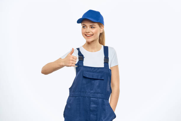 istock Woman in working uniform blue cap delivery courier delivery service 2046000599