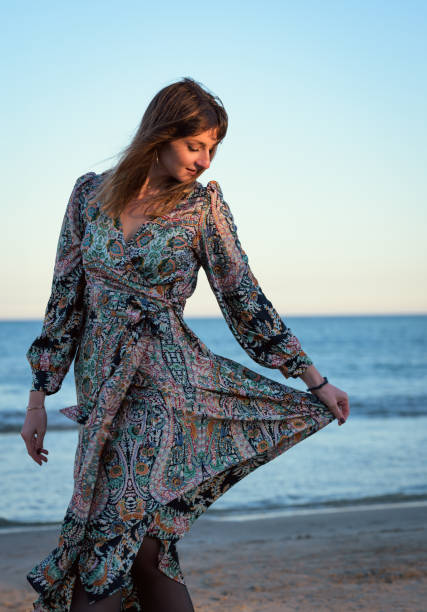 istock Woman With Long Hair Standing on Beach 2046006470