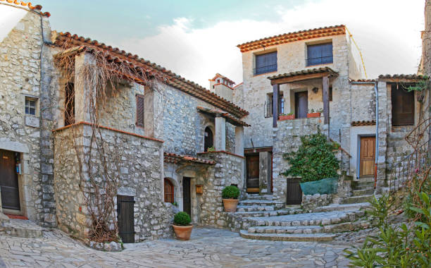 Gourdon, France - January 20, 2012: Small Street With Stone Houses in Feudal Style Village at Top of Hill South France.
