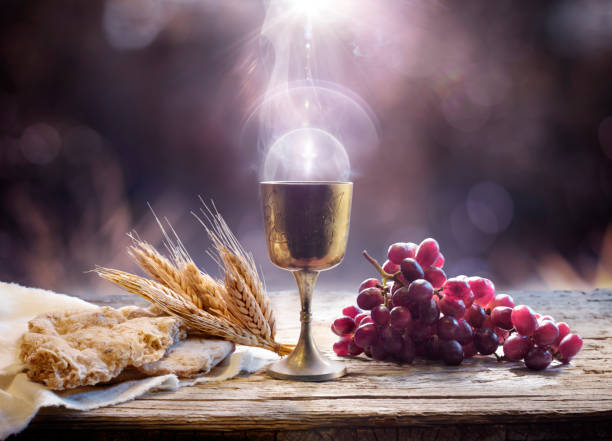 Communion - Holy Grail With Unleavened Bread And Chalice Of Wine - Last Supper With Corpus Christi Of Light stock photo