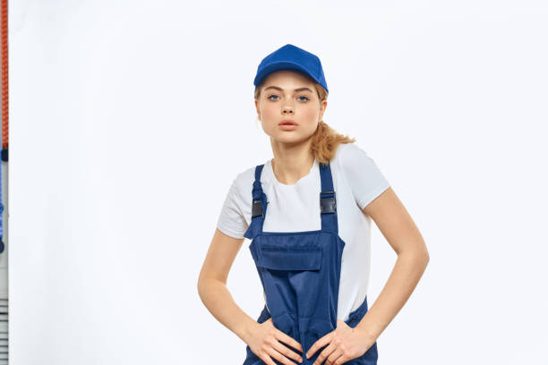 istock Woman in working uniform blue cap delivery courier delivery service 2046035364