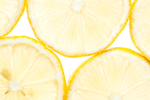 Close-up lemon slices on a white background
