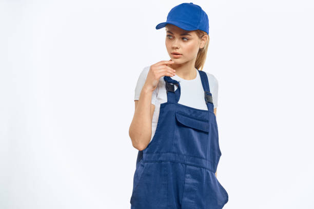 istock Woman in working uniform blue cap delivery courier delivery service 2046036403