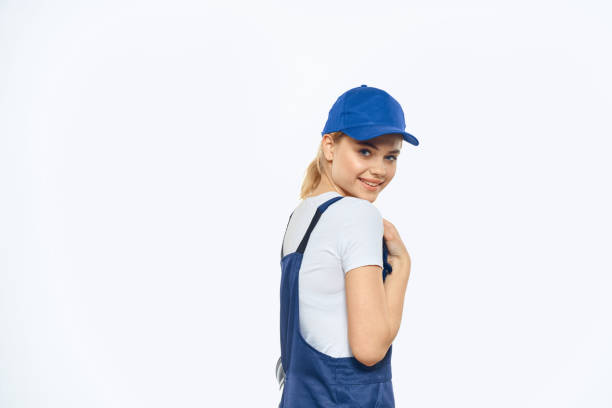 istock Woman in working uniform blue cap delivery courier delivery service 2046039052