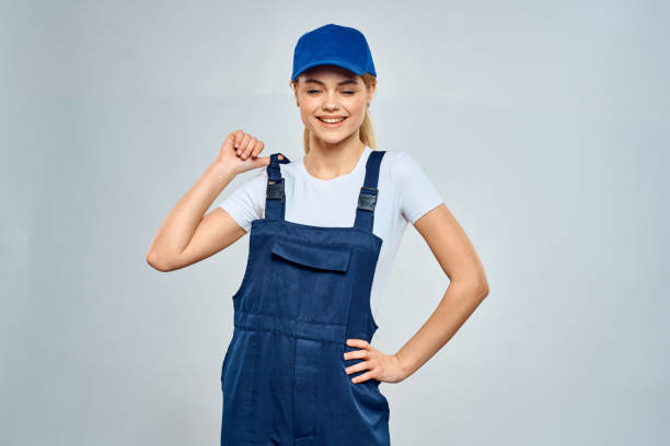 istock Woman in working uniform blue cap service lifestyle service 2046041133