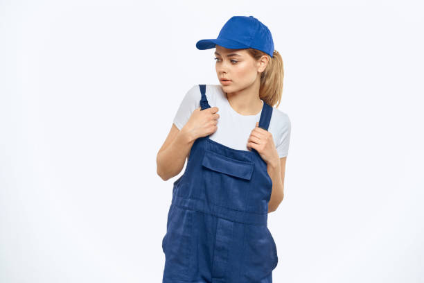 istock Woman in working uniform blue cap delivery courier delivery service 2046046330
