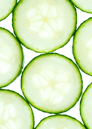 Close-up cucumber slices on a white background