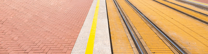 Background image, combination of roads of the pedestrian zone, dividing lines and metal rails of tram tracks, Space for copying.