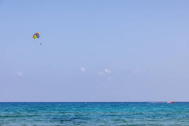 Parasailing on the beach on Crete island in Greece in summer