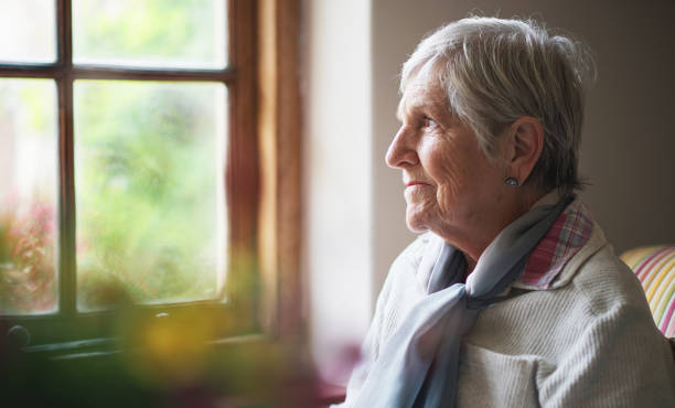 istock Window, thinking and senior woman in nursing home, reflection and remembering past life. Elderly person, hope and contemplating future or memory, nostalgia and wellness in retirement or dreaming 2046074674